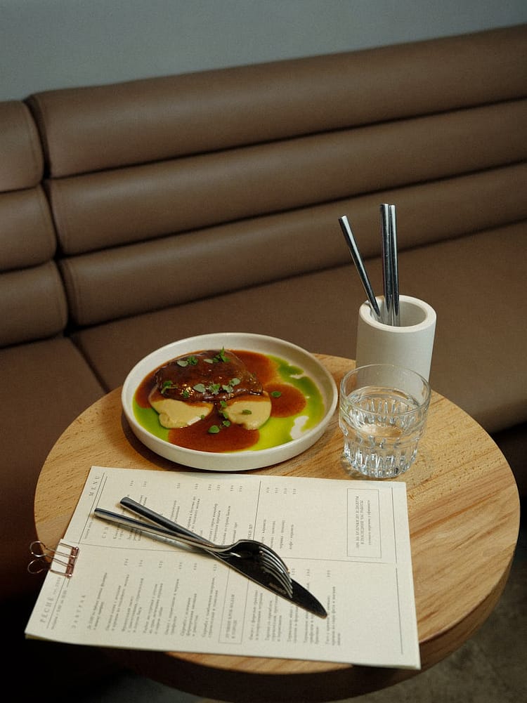 dish on a table in a restaurant next to the menu